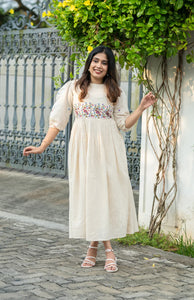 Off-white flex cotton dress with floral embroidery and crochet lace detailing on yoke and sleeves