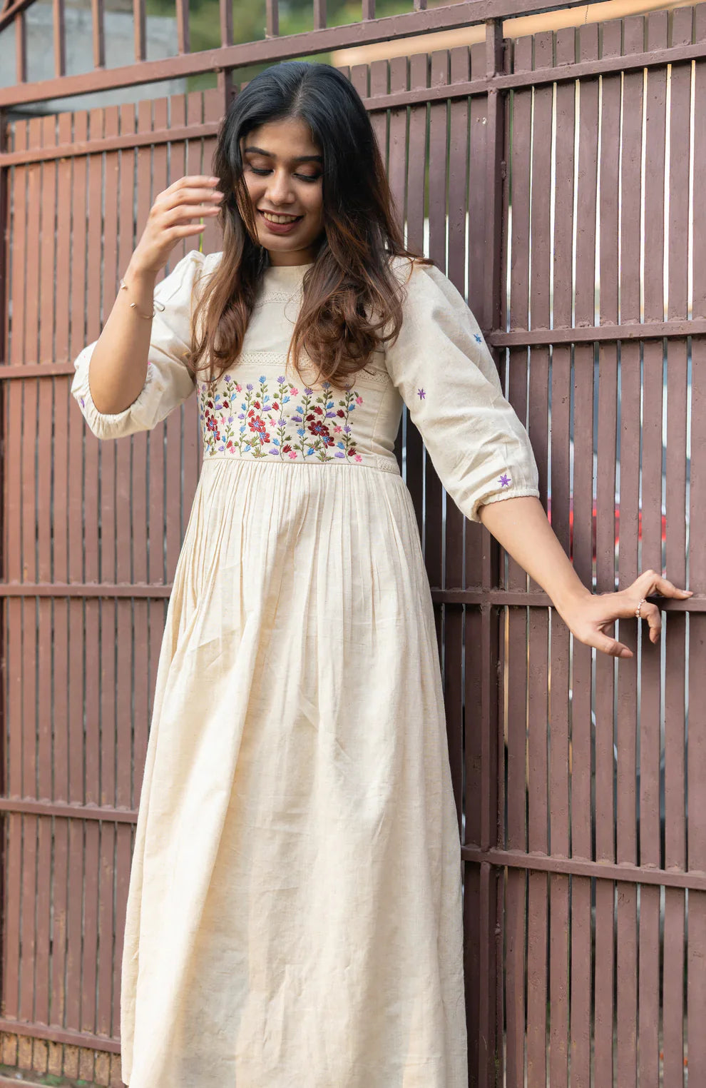 Off-white flex cotton dress with floral embroidery and crochet lace detailing on yoke and sleeves