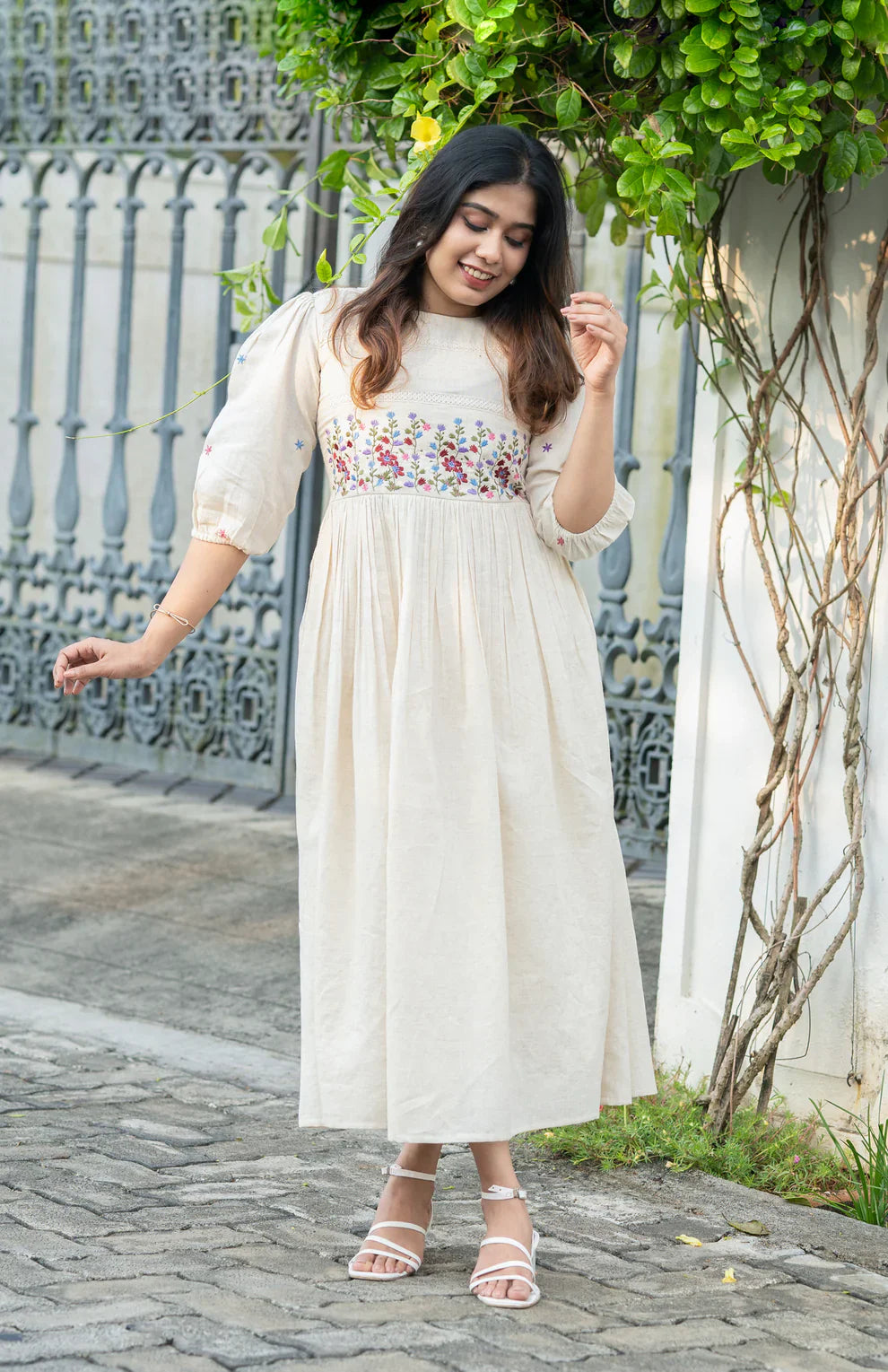Off-white flex cotton dress with floral embroidery and crochet lace detailing on yoke and sleeves