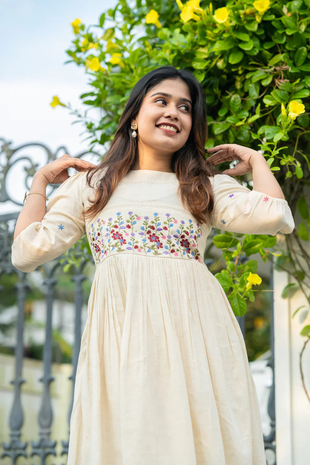 Off-white flex cotton dress with floral embroidery and crochet lace detailing on yoke and sleeves